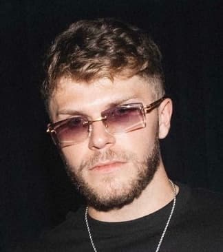 Christian Barker Barkmeta portrait with sunglasses — close-up of Doginal Dogs co-founder